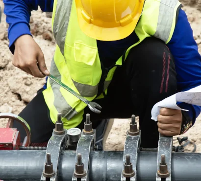 technician-is-welding-large-pipe-used-transport-water copy